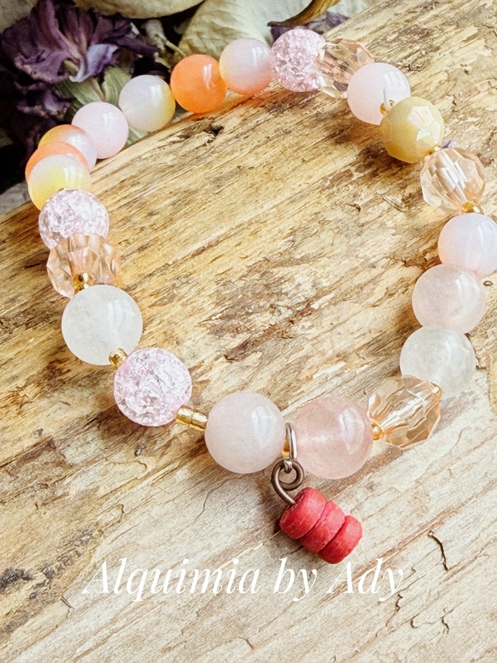 Pink quartz beaded bracelet  with gold and red accents